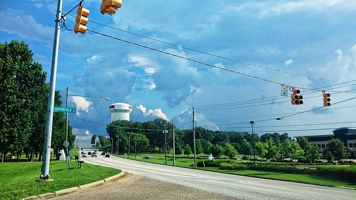 A wall of clouds cover the horizon beyond the Auburn University, Montomery water tower