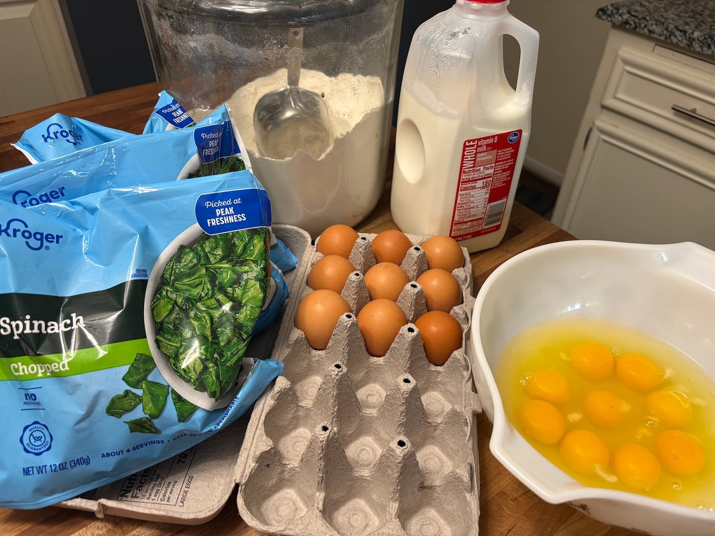 The ingredients: eggs, milk, flour, and spinach