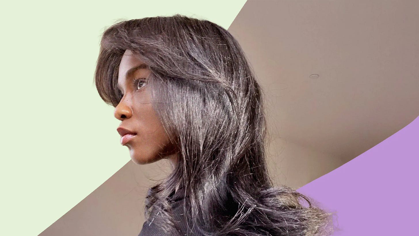 profile of woman's face with long hair, layered at her cheekbones