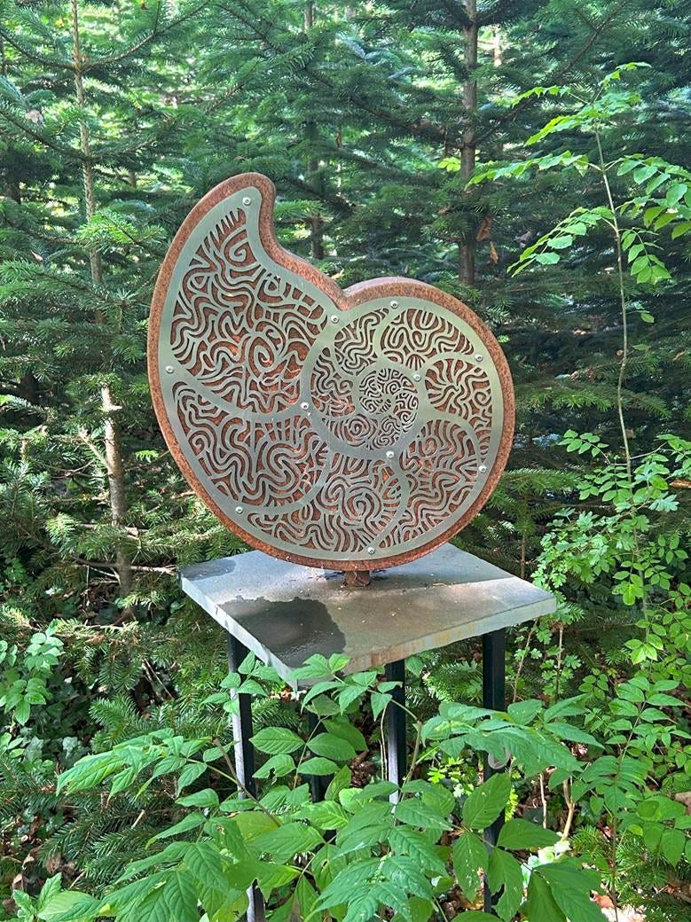 A sculpture in the woods

AI-generated content may be incorrect.