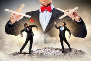 Image of young businessman puppeteer