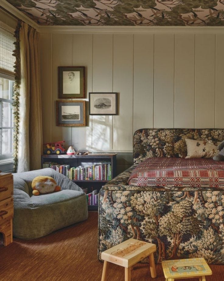 This may contain: a bed sitting in the middle of a bedroom next to two chairs This may contain: a bed sitting in the middle of a bedroom next to two chairs