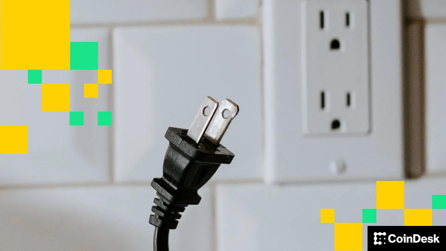 A plug disconnected from its electricity socket.