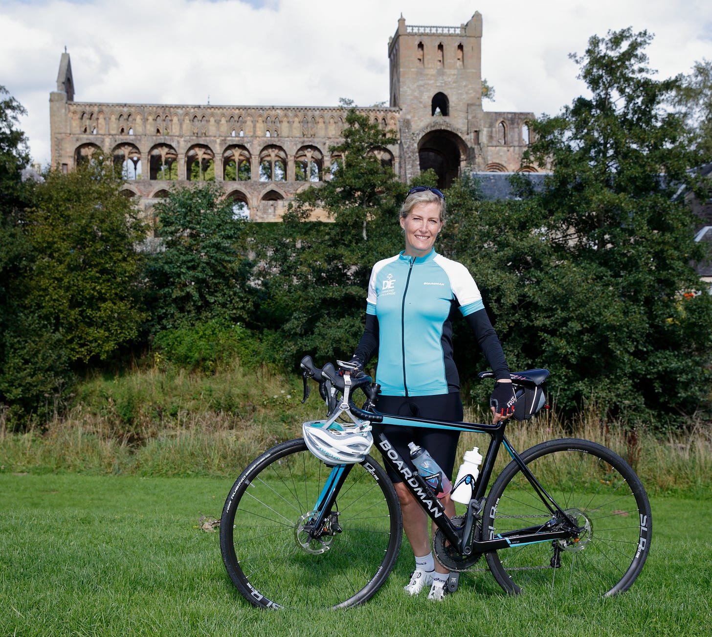Duchess Sophie standing next to a bike.