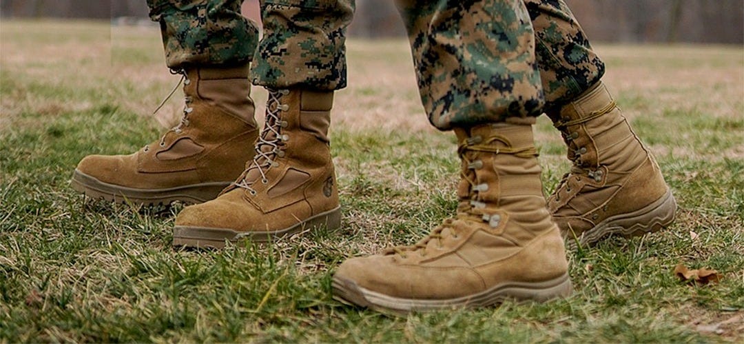 a couple of soldiers standing next to each other