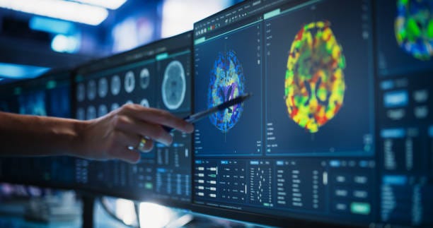 Modern Medical Research Center: Anonymous Doctor Pointing At Desktop Computer Monitor With CT Scan Of Patient's Spinal Cord. Specialist Looking For Tumors Or Damage, Looking For Treatment Methods. Modern Medical Research Center: Anonymous Doctor Pointing At Desktop Computer Monitor With CT Scan Of Patient's Spinal Cord. Specialist Looking For Tumors Or Damage, Looking For Treatment Methods. neuroscience stock pictures, royalty-free photos & images