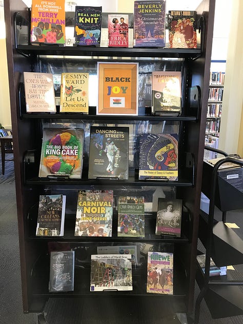 Displays of books including themes like "Black Joy," "Black Future Month," "Graphic Novel Black History Month," "All You Need Is Love?" and "Fighting Together Is Greater Than Fighting Each Other"