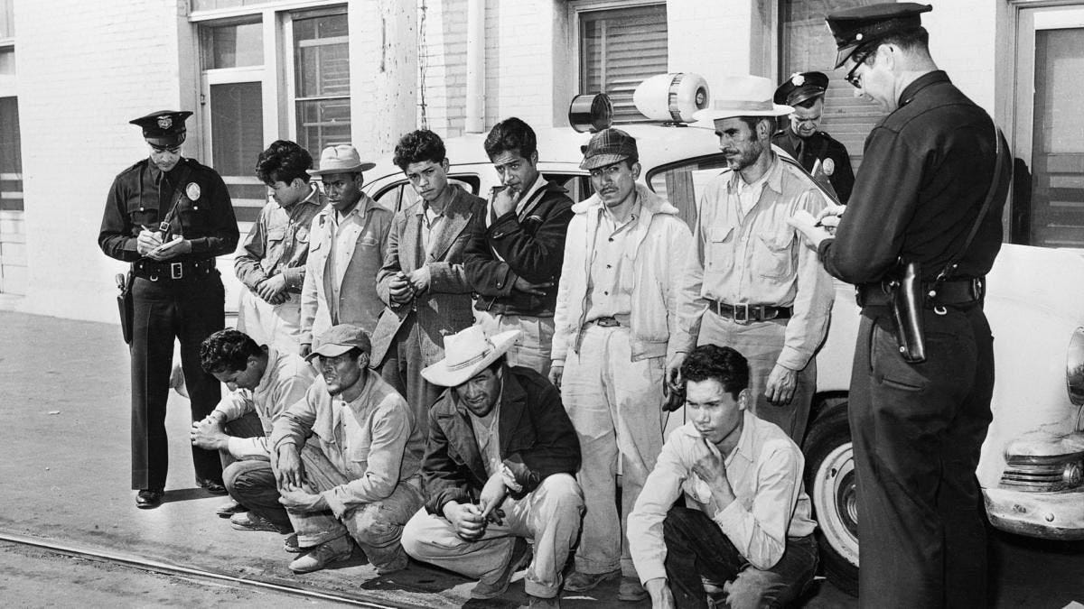 A group of Mexicans who were taken off freight trains in Los Angeles, after two days without food or water, in 1953. (Credit: Getty Images)