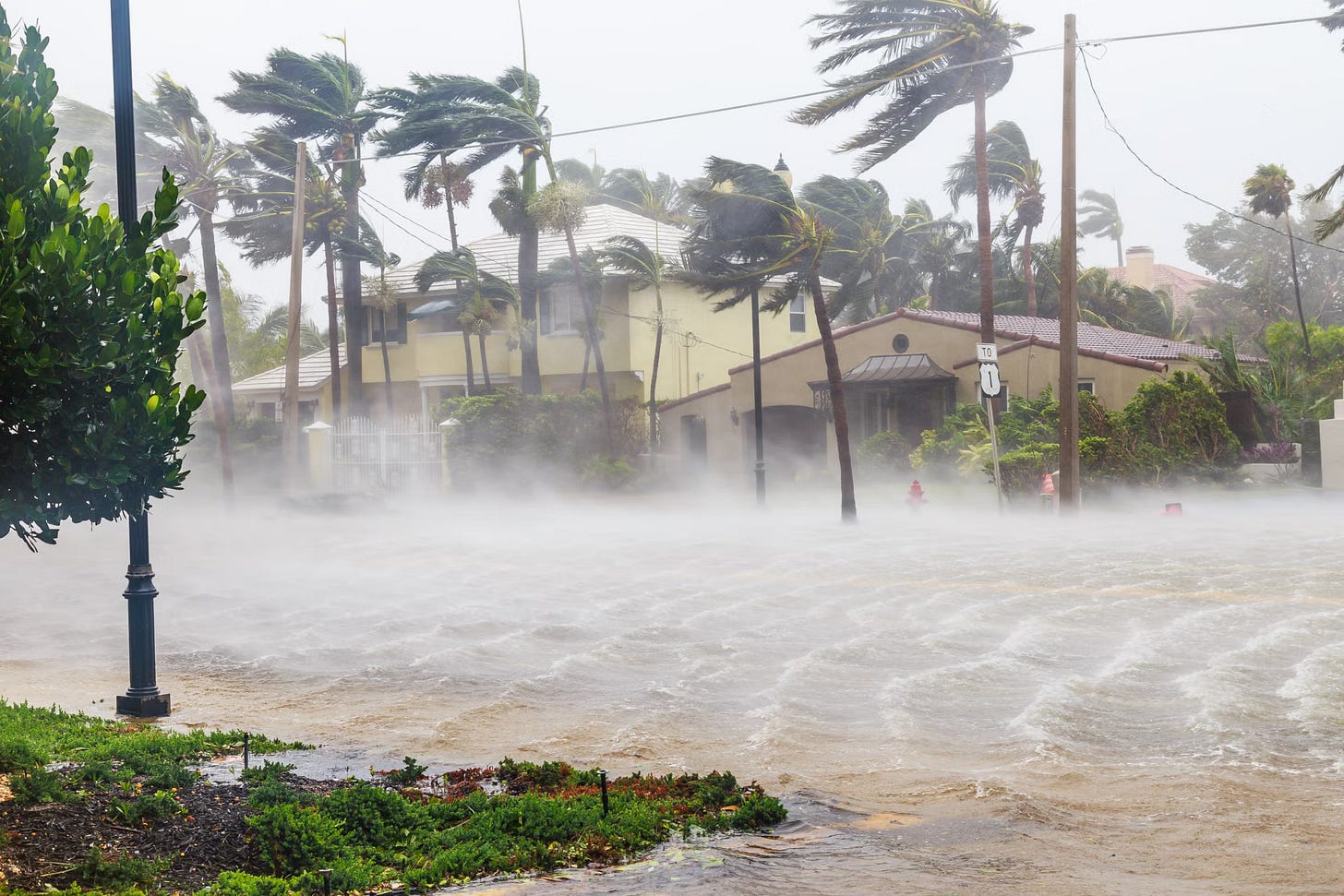Storm damaged homes sit exposed beneath darkening skies in Jamaica following Hurricane Melissa, highlighting the growing urgency around resilient housing, climate adaptation, and rebuilding stronger communities across the island.
