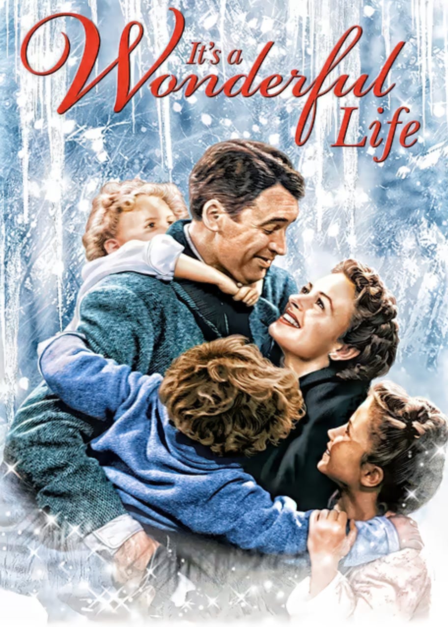 Poster for the movie It's a Wonderful Life featuring a smiling man embracing a woman and two children in a joyful family hug. The title “It’s a Wonderful Life” appears in large red script at the top against a frosty blue-and-white winter background.