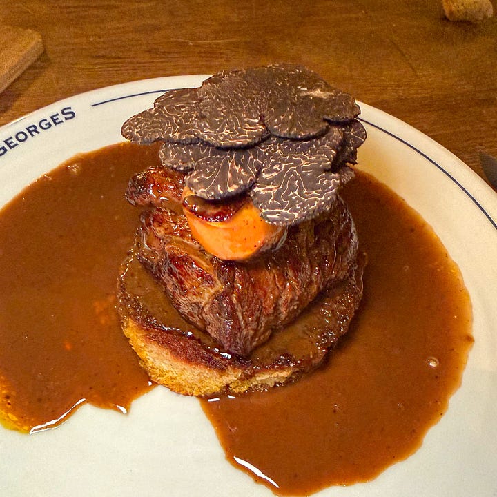 Tournedos Rossini at Le Bon Georges — filet mignon with seared foie gras and shaved black truffles and also wild duck with pear