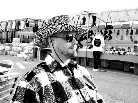 Photograph of cityscapes and more rural market and street landscapes with Russell