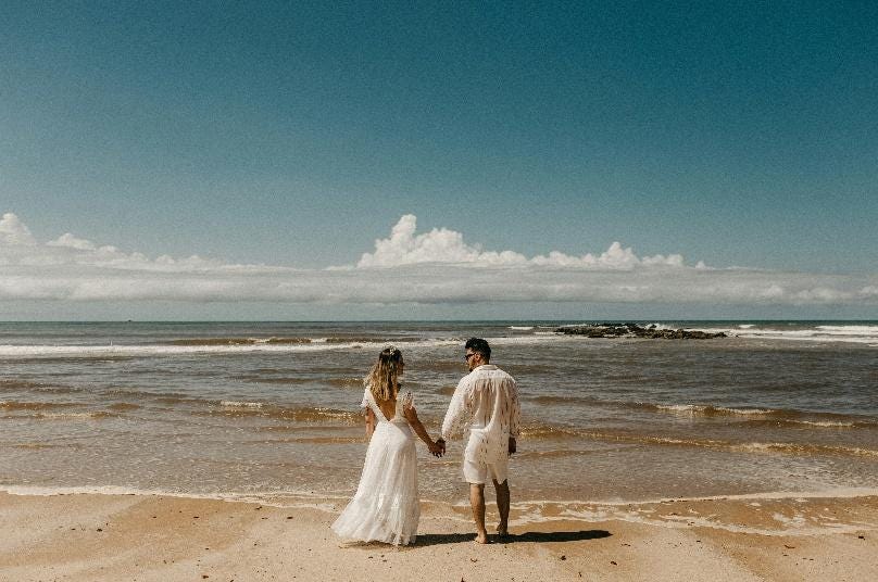 A person and person holding hands on a beach

AI-generated content may be incorrect.