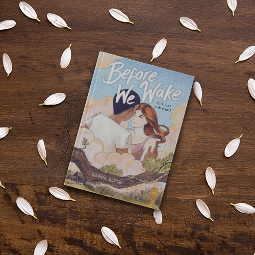 Book "Before We Wake" on a table with flower petals