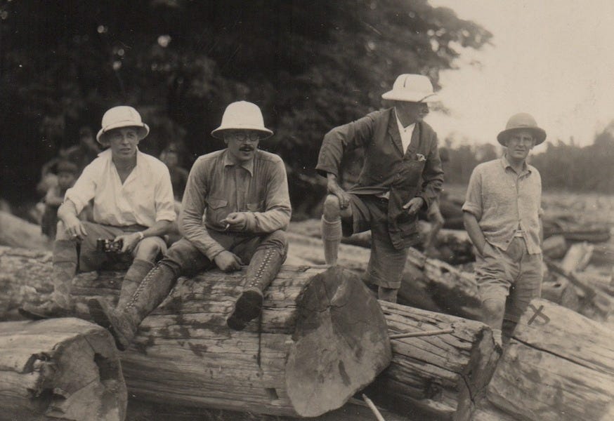 Four man with tree trunks Four man with tree trunks