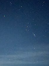 Photos of the pine trees again the Northern Lights, a bright moon over Lake Superior and stars in the sky.