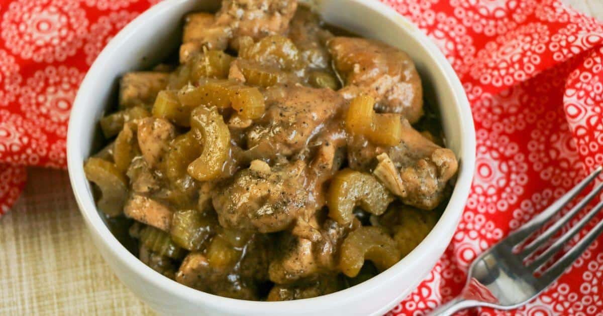 Panda Express Black Pepper Chicken in a white bowl against a red and white background.