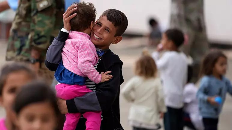 A person carrying a child

Description automatically generated with low confidence