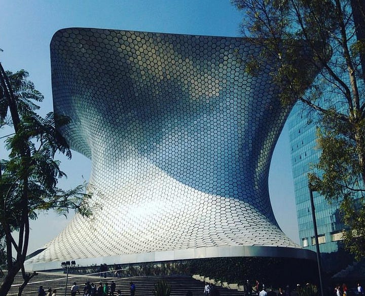 A sassy gay poses in front of the Pyramid of the Moon at the ruins Teotihoucan. The glimmering Museo Soumaya in Polanco