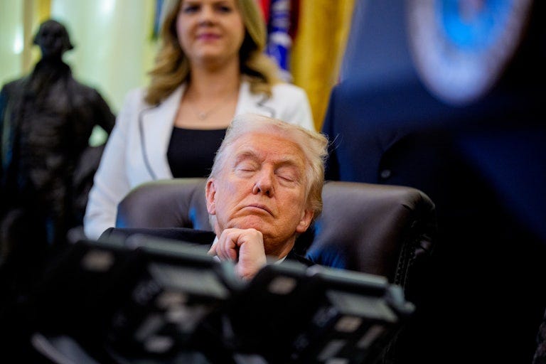 President Trump rests his head on his hands as he sleeps in his chair in the Oval Office of the White House.