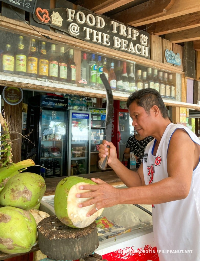 Coconut or buko being hacked open