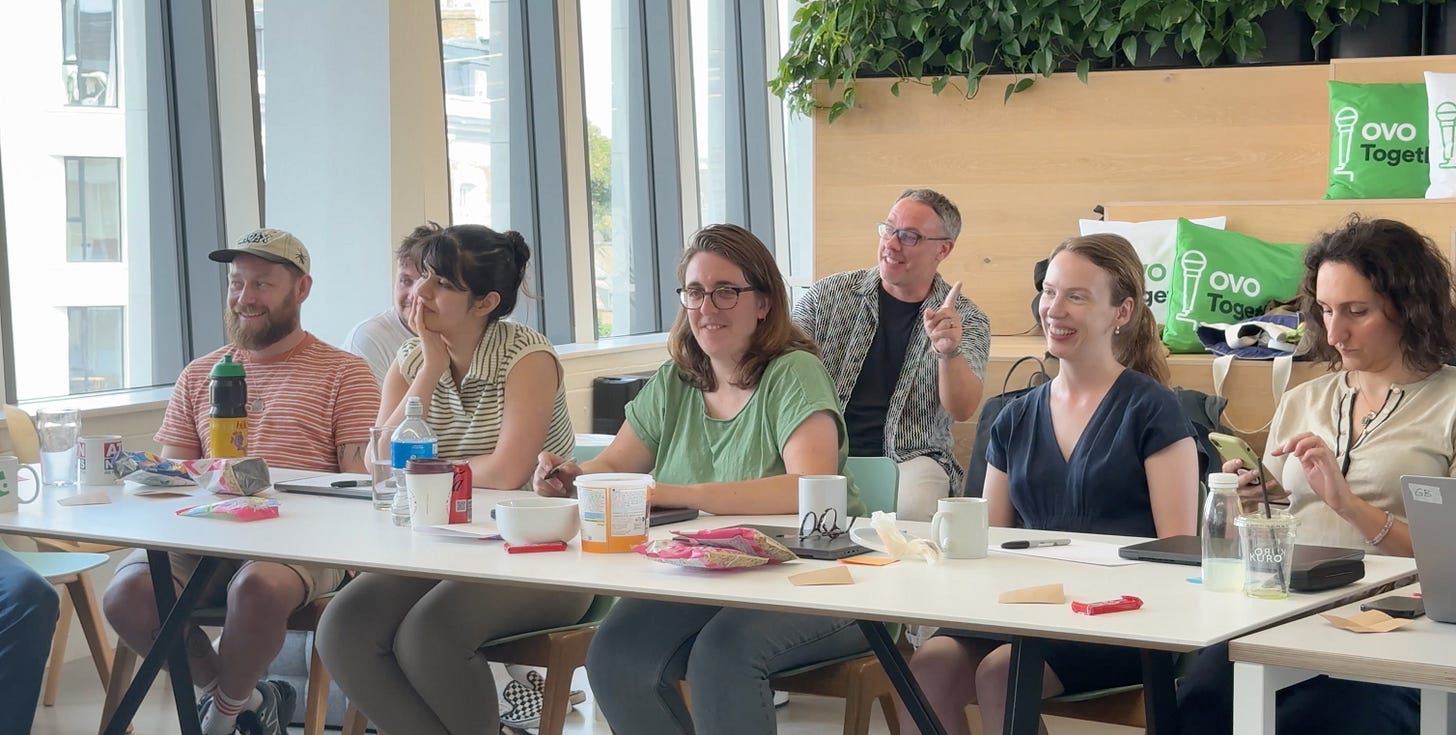 members of the OVO design team in a workshop envrionment looking happy