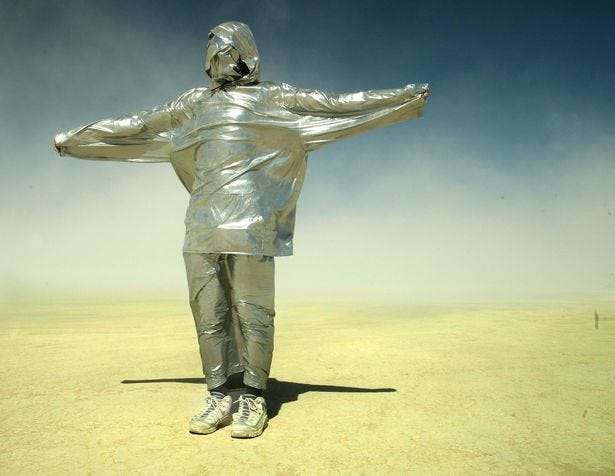 A man wrapped in duct tape stands during a sandstorm at the Burning Man Festival back in 2003 A man wrapped in duct tape stands during a sandstorm at the Burning Man Festival back in 2003