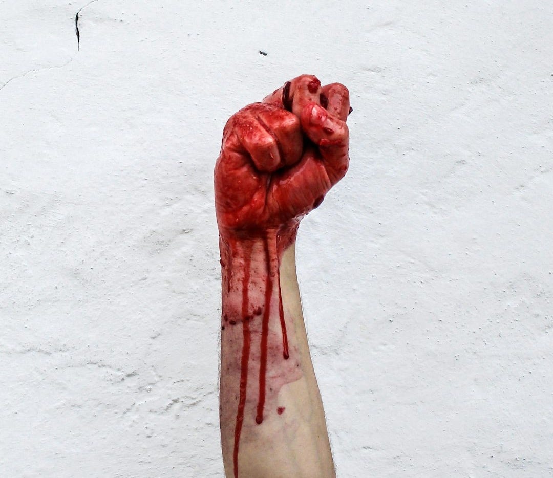 person raishing his hand