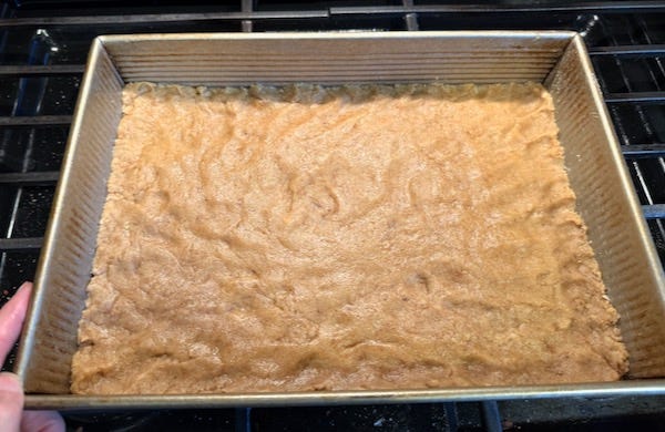 cake pan with base of toffee bars