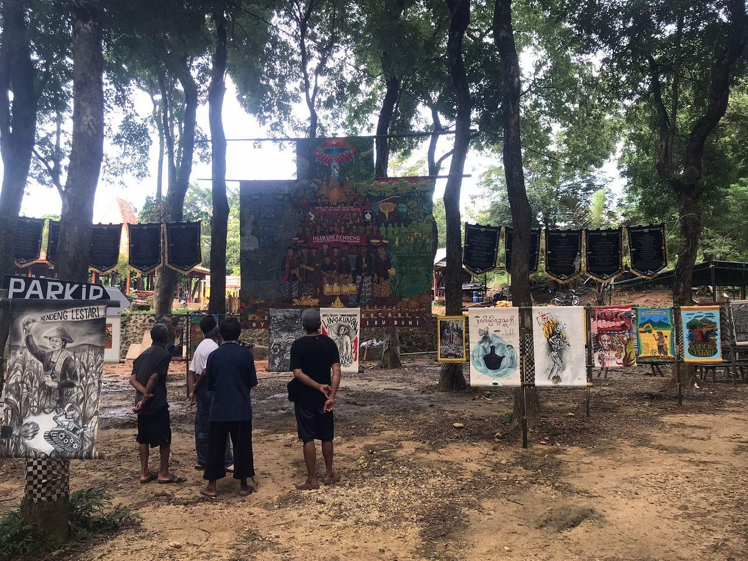 A group of people standing in front of a sign
Description automatically generated A group of people standing in front of a sign
Description automatically generated