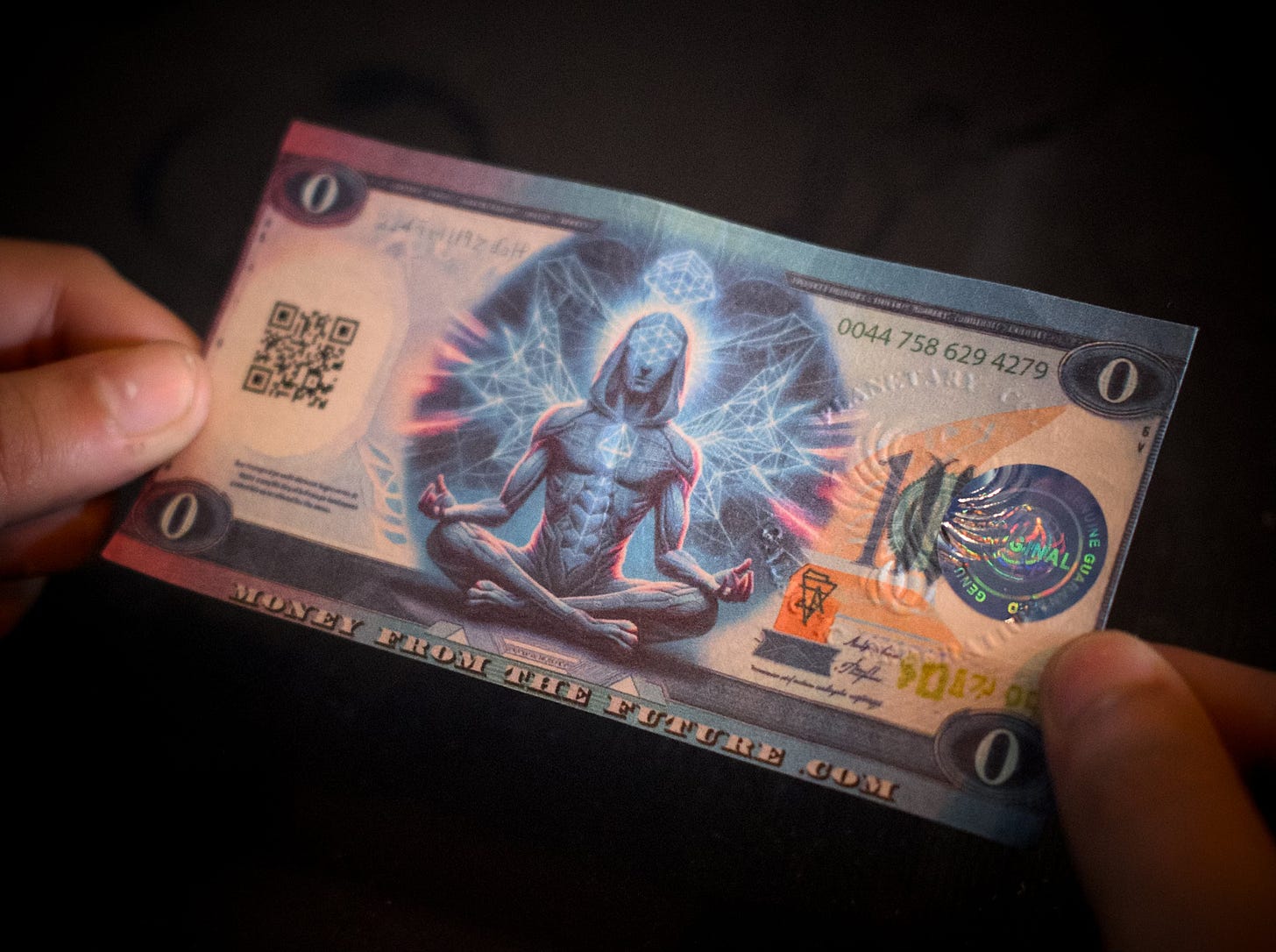 A money type note showing the number zero in each corner and a person meditating in the middle