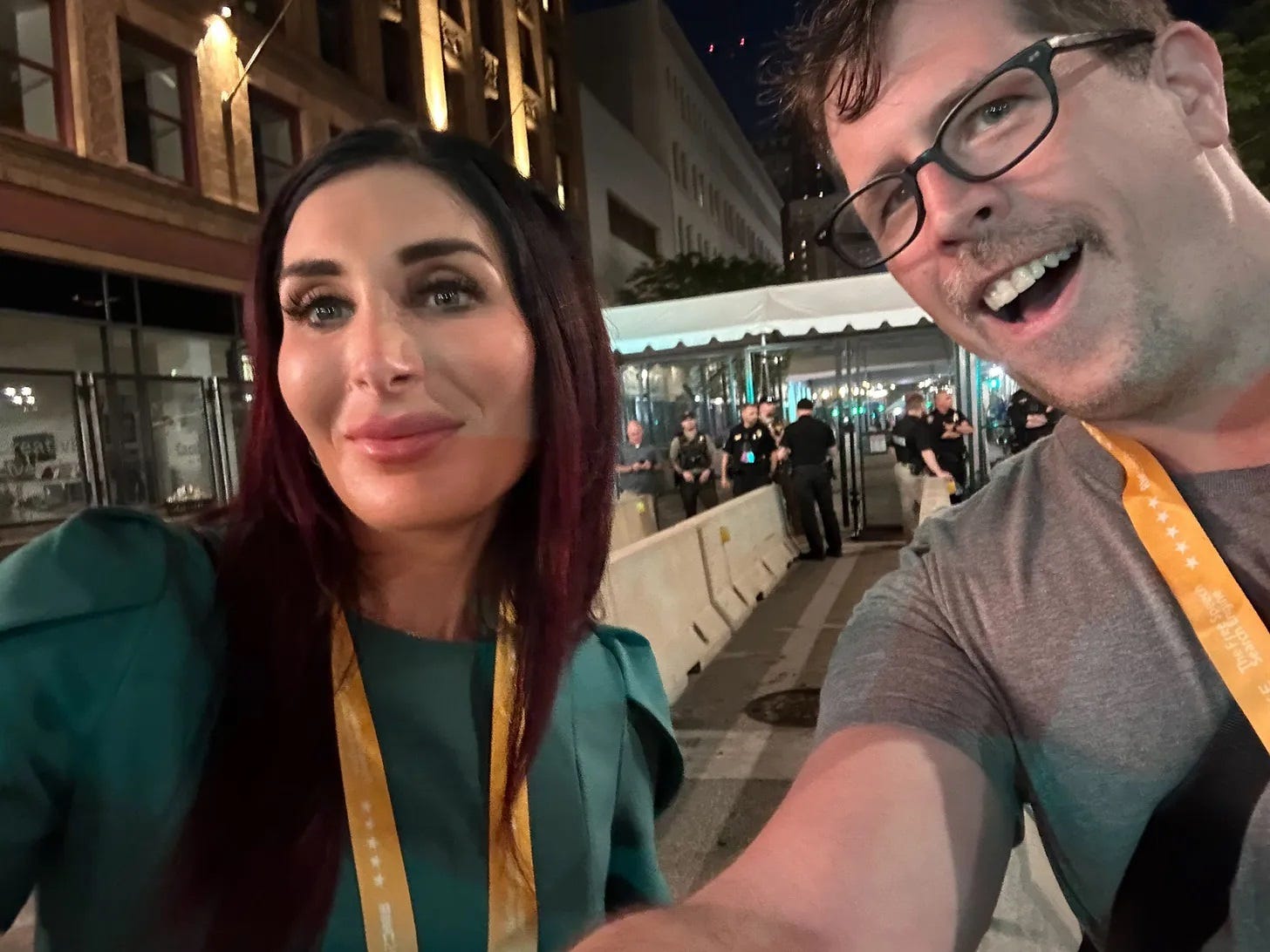 Laura Loomer puts up with being in a selfie taken by Wonkette's own Evan Hurst, outside the concrete barriers and security checkpoint for one of the entrances to the Republican National Convention in Milwaukee last year. Laura Loomer puts up with being in a selfie taken by Wonkette's own Evan Hurst, outside the concrete barriers and security checkpoint for one of the entrances to the Republican National Convention in Milwaukee last year.