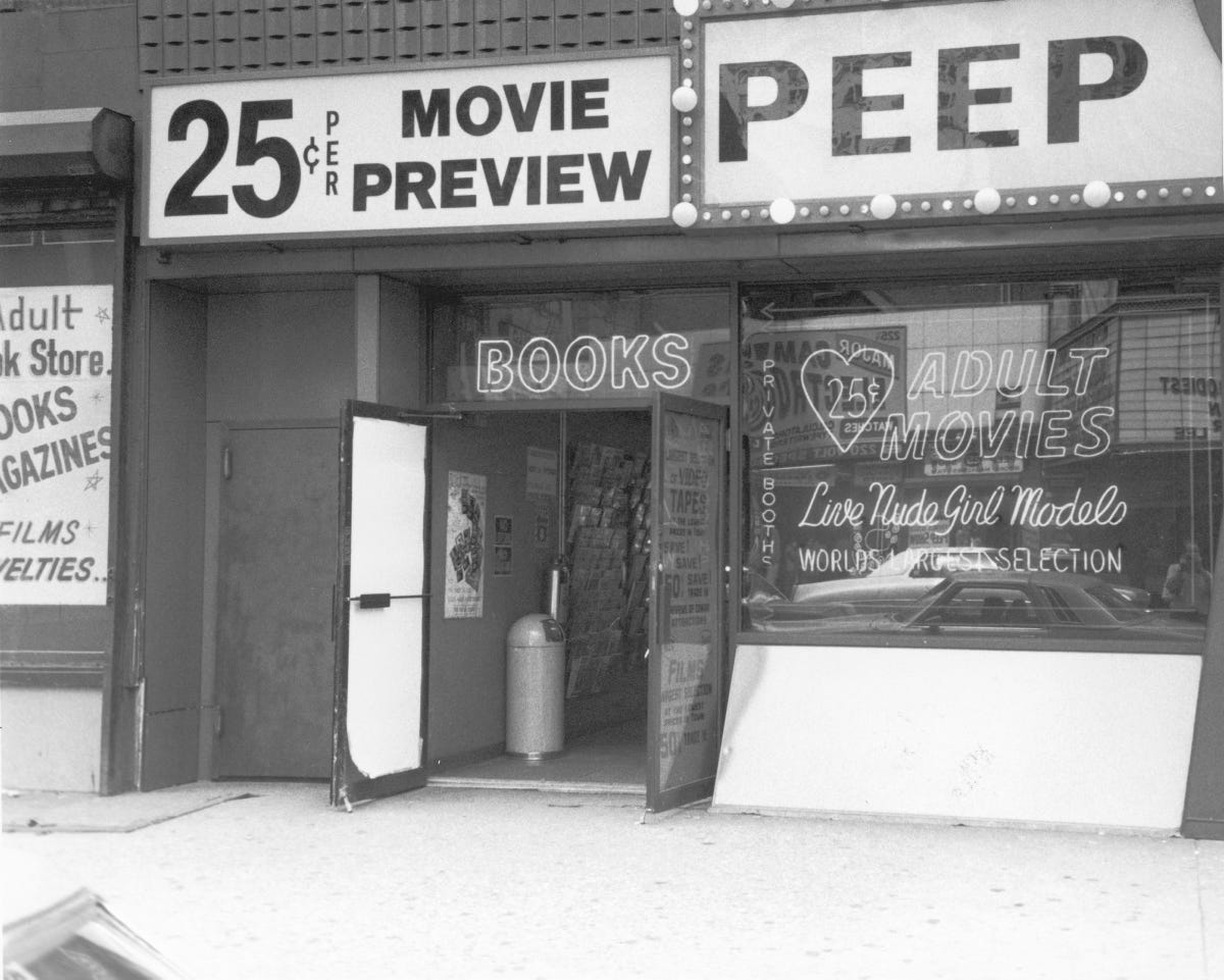 An exterior view of a peep show and adult bookstore in Times Square in the 1970s.