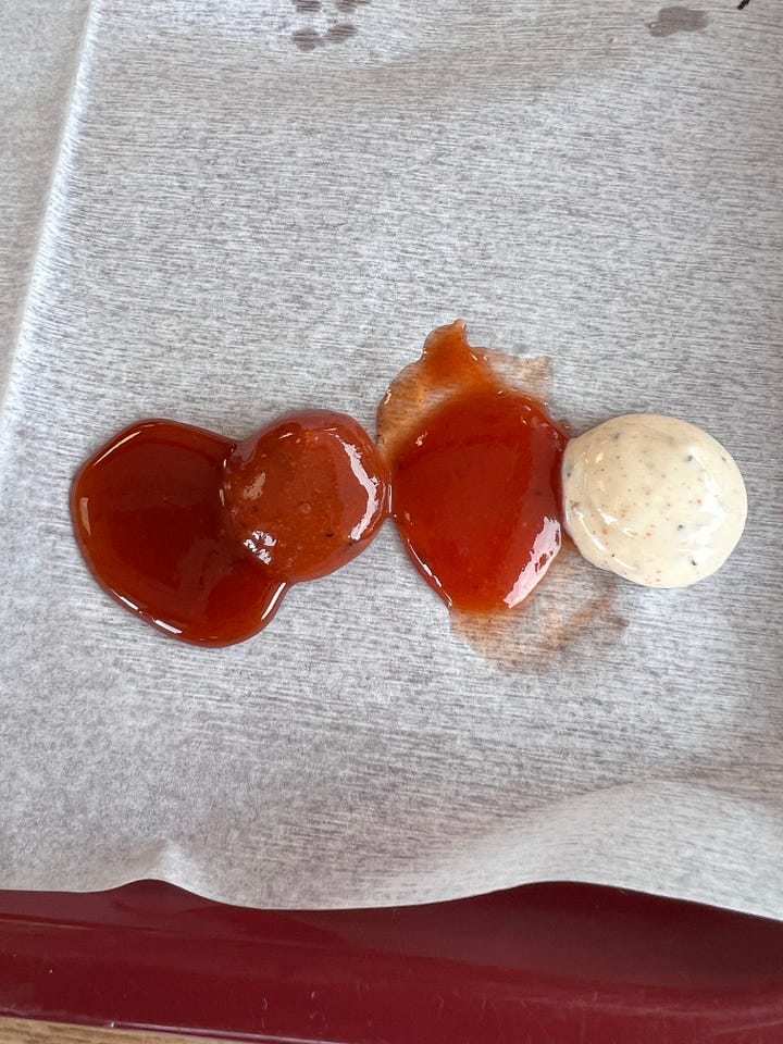 Barbecue sauces in bottles and on serving paper