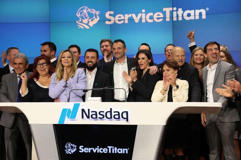 Ara Mahdessian, CEO and co-founder of ServiceTitan, and Vahe Kuzoyan, president and co-founder of ServiceTitan, attend the company's IPO at the Nasdaq Market in New York City, U.S., December 12, 2024. REUTERS/Brendan McDermid
