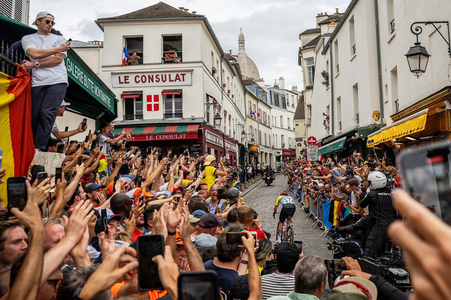Remco Evenepoel of Team Belgium attacks in the breakaway passing through the Cote de la butte Montmartre while fans cheers during the Men's Road Race on day eight of the Olympic Games at trocadero on August 03, 2024 in Paris, France. (David Ramos/Getty Images)