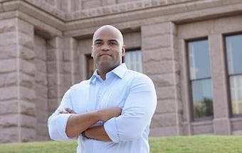 Colin with arms crossed