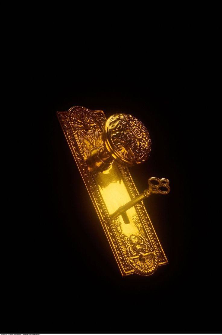 This may contain: a golden door handle on a black background
