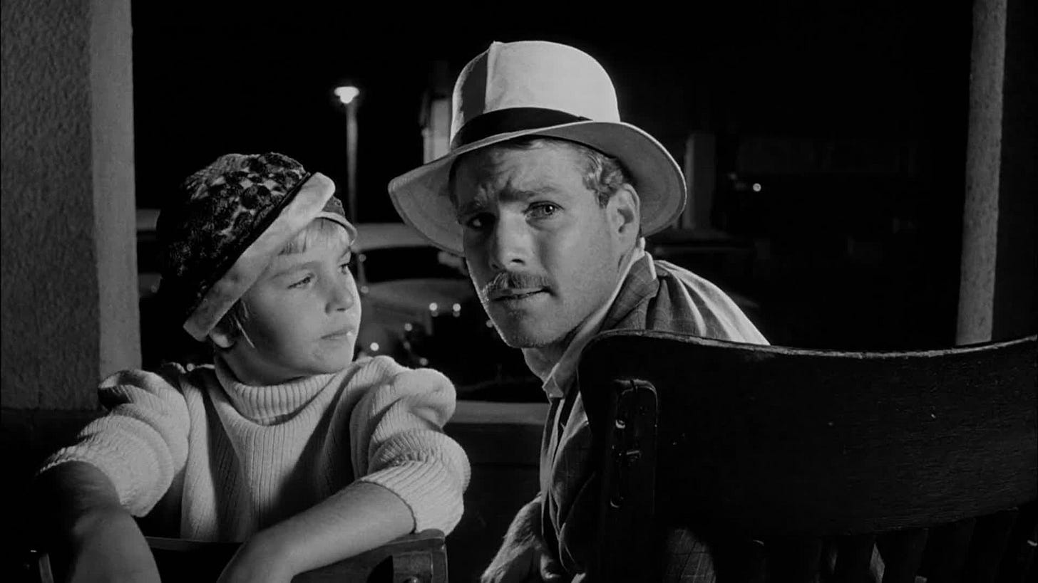 Paper Moon | Still features Ryan O'Neal looking back while Tatum O'Neal looks on.