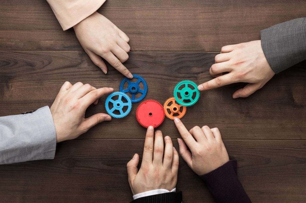 Teamwork Concept On The Brown Wooden Table Background Teamwork Concept On The Brown Wooden Table Background