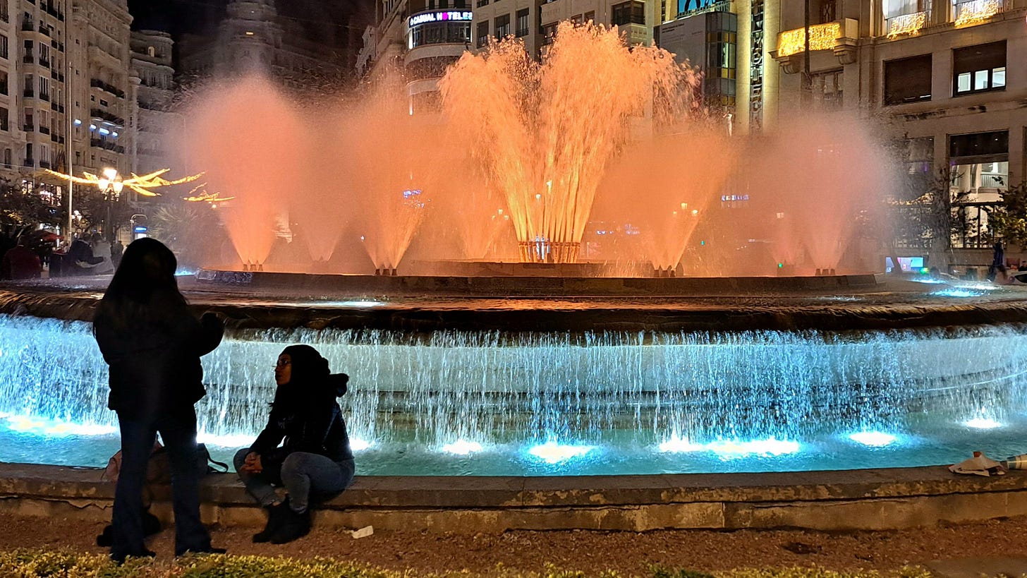 a lit up fountain in the Ayuntamiento Valencia a lit up fountain in the Ayuntamiento Valencia