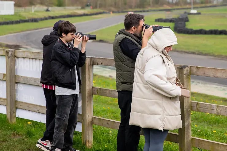 My image showing a father and Son taking photos trackside at Three Sisters Circuit, Wigan. April 2024. My image showing a father and Son taking photos trackside at Three Sisters Circuit, Wigan. April 2024.