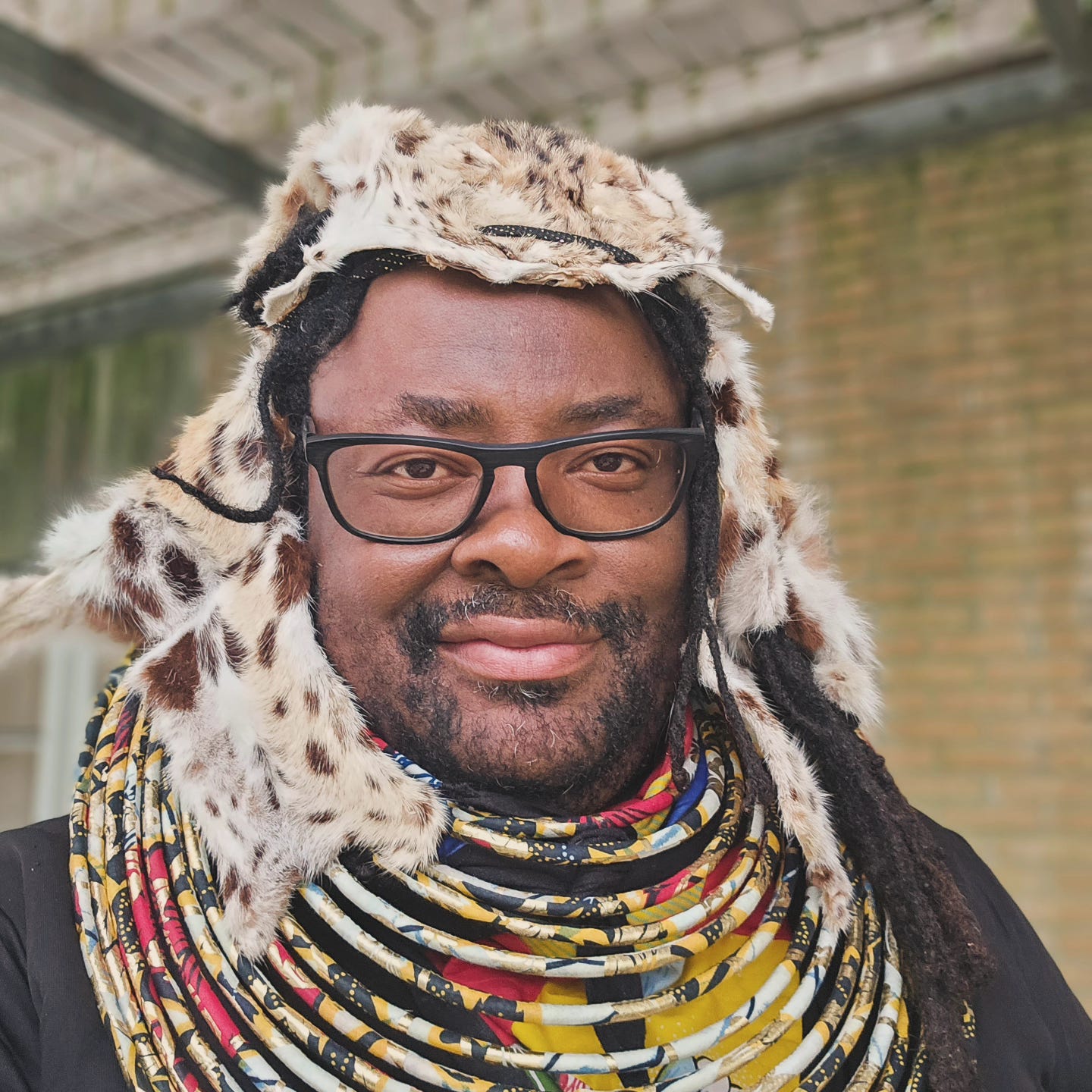 FatbikeHero in Performance Art Costume ie Serval Cat Headdress and African Jewelry FatbikeHero in Performance Art Costume ie Serval Cat Headdress and African Jewelry
