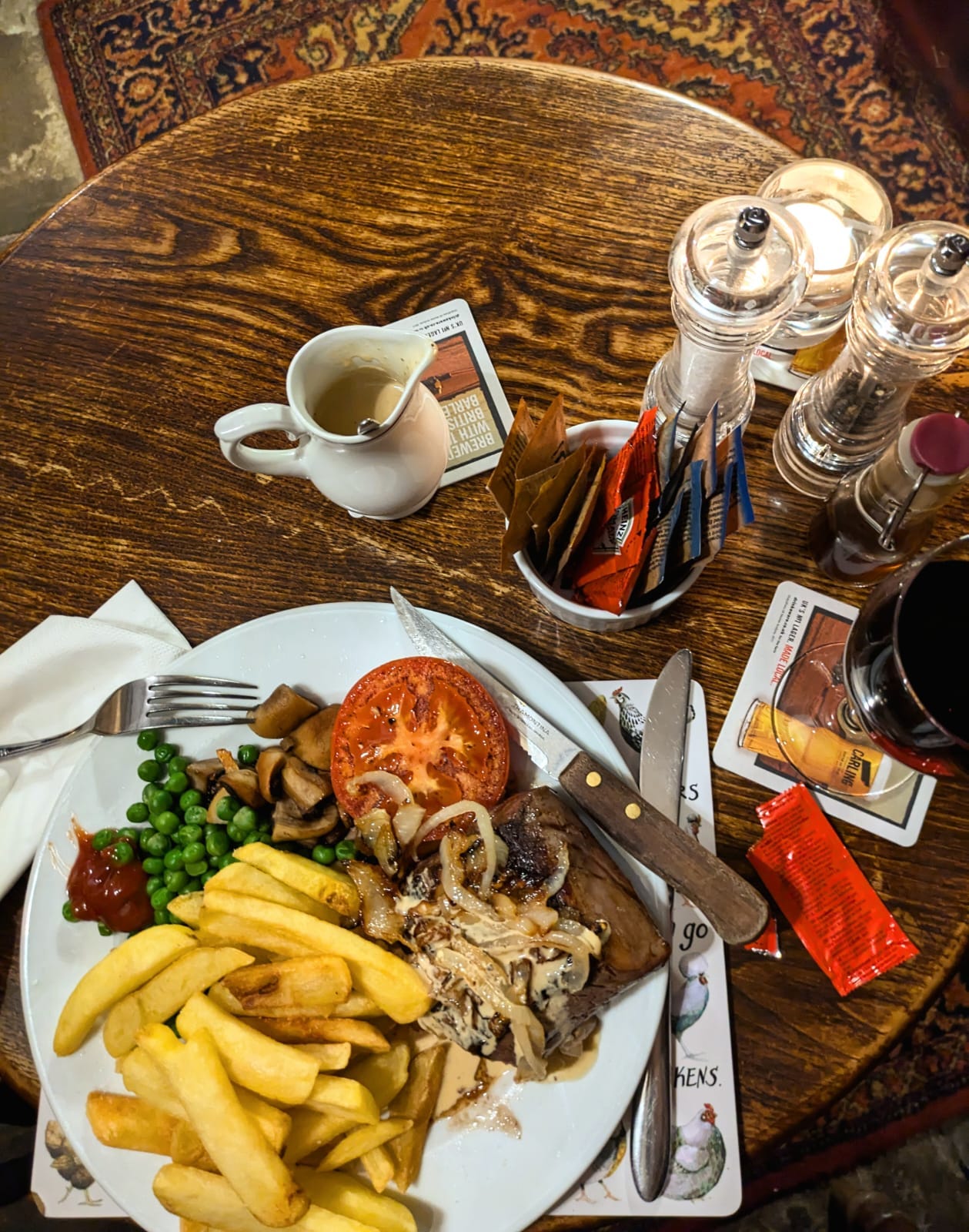 A flat lay of the plate described - fillet steak, chips and veg at the carpenters arms