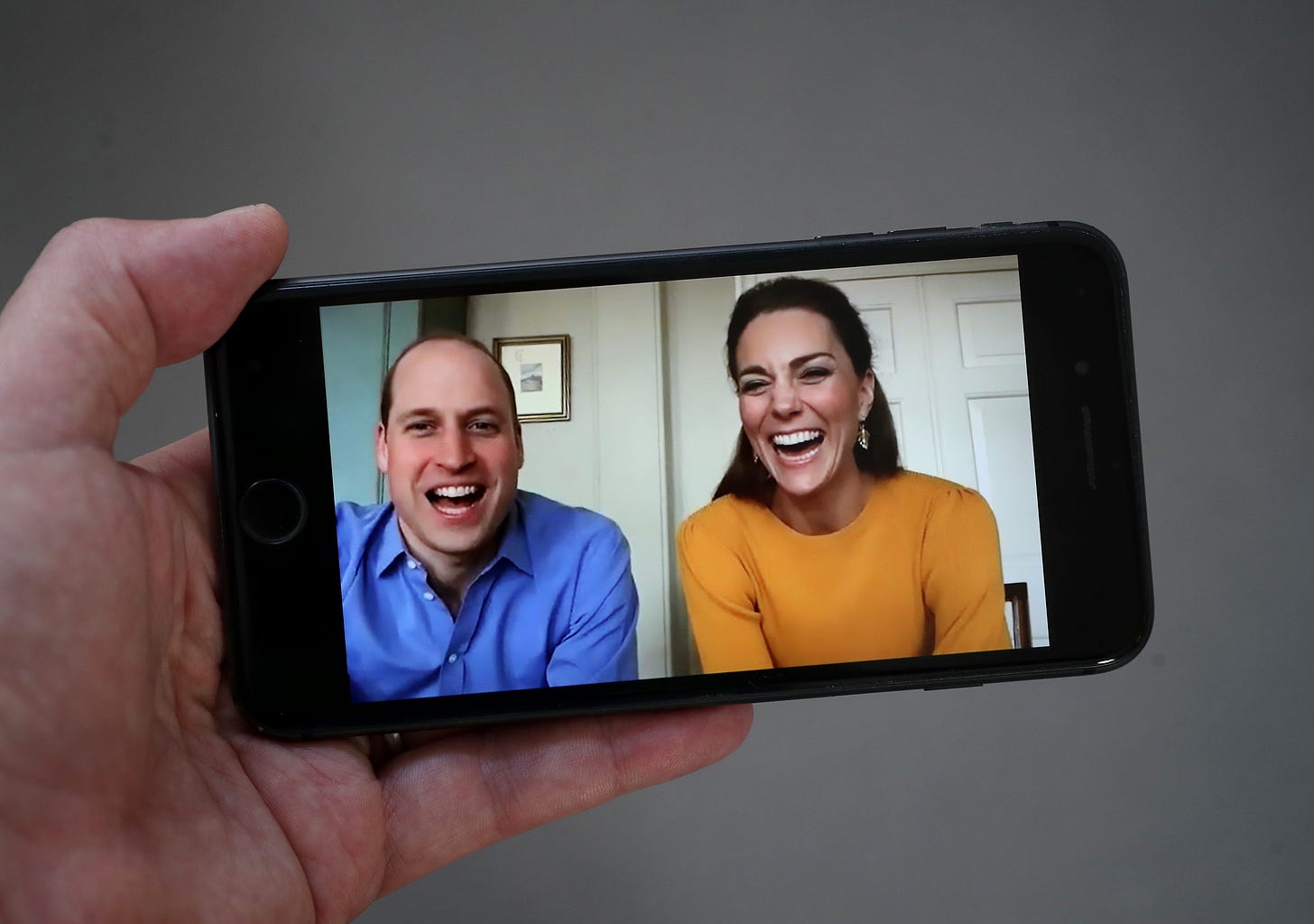 A phone with Prince William and Princess Catherine