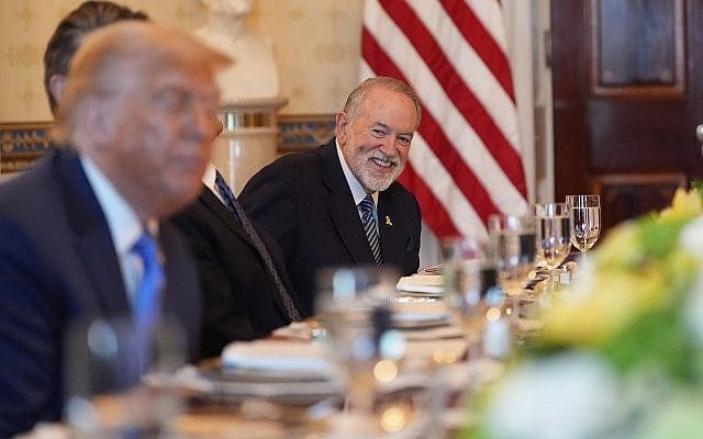 US Ambassador to Israel Mike Huckabee watches as President Donald Trump, in foreground at left, meets with Israel's Prime Minister Benjamin Netanyahu in the Blue Room of the White House, Monday, July 7, 2025, in Washington. (AP Photo/Alex Brandon)