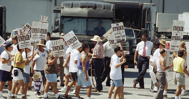 A group of UPS drivers strikes in 1997. A group of UPS drivers strikes in 1997.