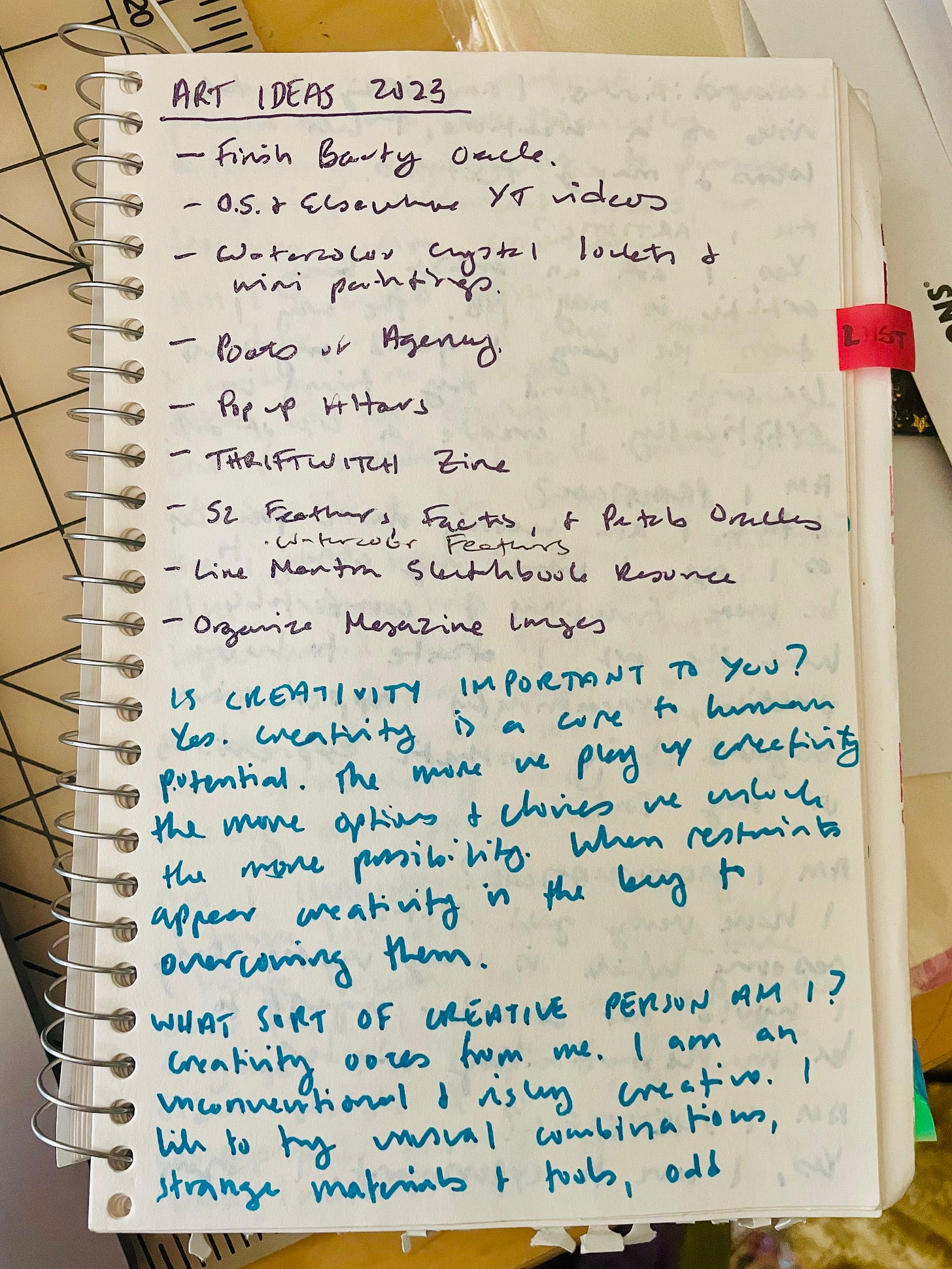 a page from a sketchbook in purple a list of art ideas and in blue to questions. 