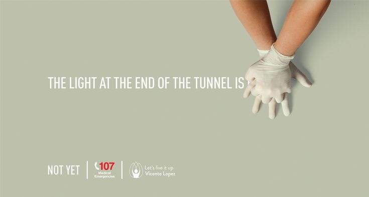 This may contain: an advertisement for the light at the end of the tunnel is written in white gloves