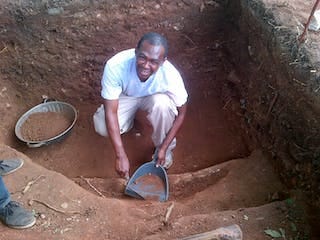 A man holding work tools